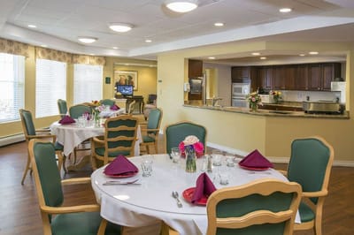Dining area with neatly set tables in a bright interior
