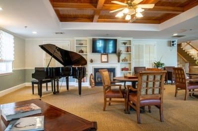 Common area with piano and seating