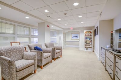 Interior hallway with seating area and shelving