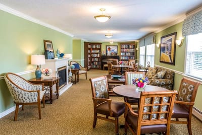 Bright common area with bookshelves and seating
