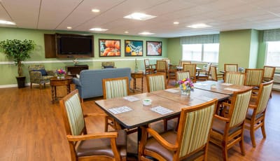 Bright dining room with tables and chairs arranged