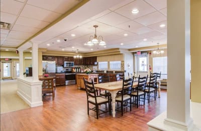 Bright dining area with kitchen and seating