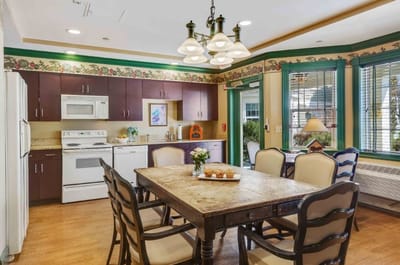 Dining area with a table and kitchen appliances