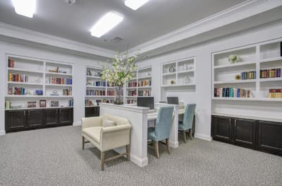 Bright common area with bookshelves and seating