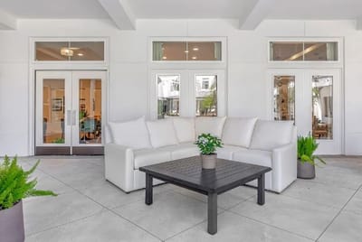 Outdoor lounge area with seating and plants