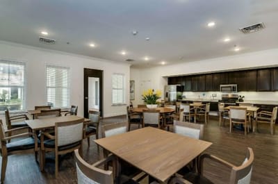 Interior view of a common dining area with wooden tables