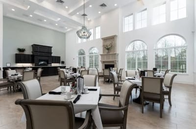 Bright dining room with elegant decor and large windows