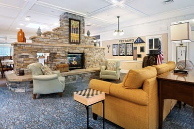 Cozy lobby area with a fireplace and seating