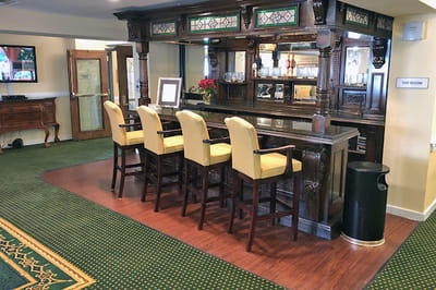 Interior bar area with seating and wooden decor