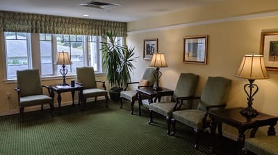 Cozy seating area in a common room with lamps