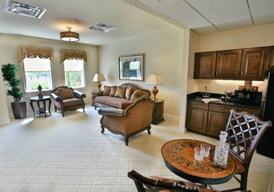 Well-furnished resident room with living area and kitchenette