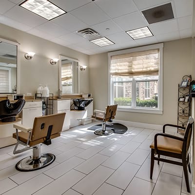 Interior of a salon with styling chairs and mirrors