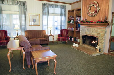 Cozy common area with seating and a fireplace