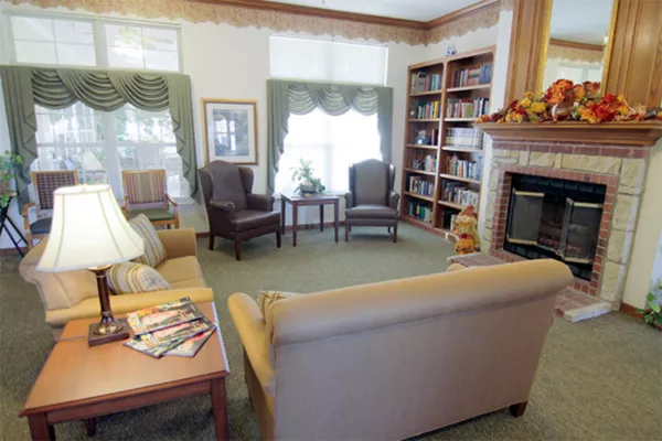 Cozy common area with bookshelves and seating