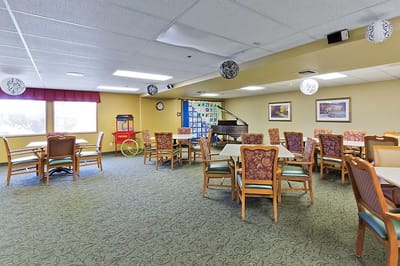 Bright dining area with tables and chairs