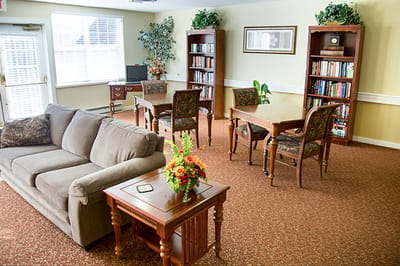 Common area with seating and bookshelves