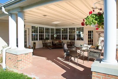 Outdoor sitting area with chairs and flowers