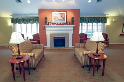 Brightly lit common area with cozy seating