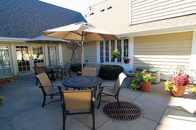 Outdoor seating area with tables and umbrellas