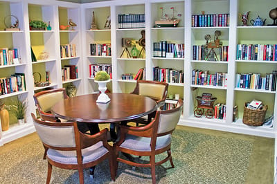 Cozy reading nook with bookshelves and a dining table