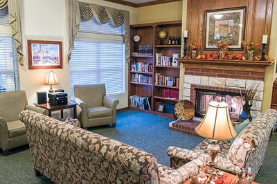 Cozy common area with seating and a fireplace