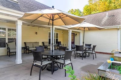 Outdoor patio area with umbrellas and seating