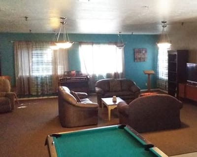 Common area with couches and pool table