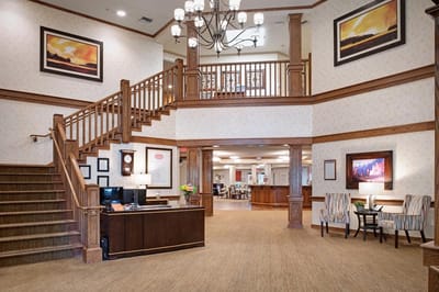 Lobby area with staircase and seating