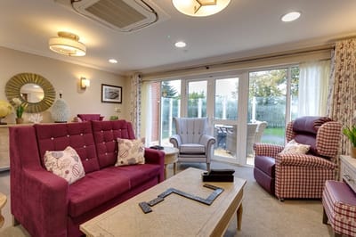 Interior view of a cozy common area with seating