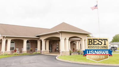 Exterior view of Cedar Trails Senior Living entrance with award logo
