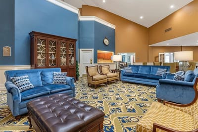 Bright common area with blue seating and decor