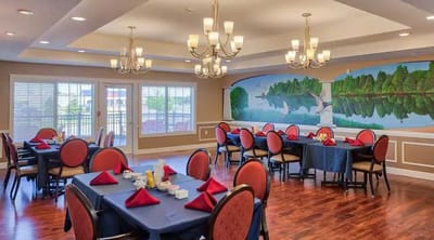 Dining area with tables and decorative mural