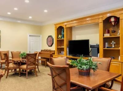 Interior common area with dining tables and plants