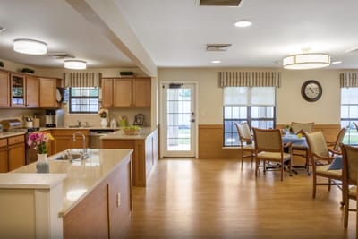 Bright and inviting dining room with kitchen area