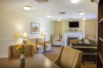 Comfortable common area with seating and a piano