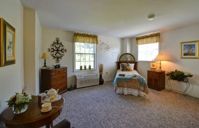 Cozy resident room with bed and decorations