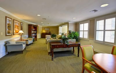 Bright common area with seating and bookshelves