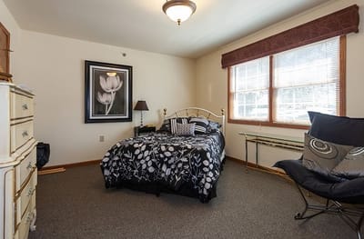 A cozy resident room with a bed and decor