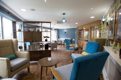 Brightly lit common area with comfortable seating