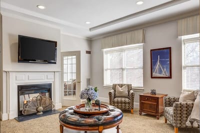 Common area with seating and television.