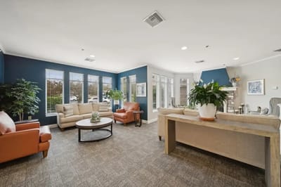 Bright common area with comfortable seating and natural light