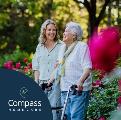 Residents enjoying a garden walk with caregiver