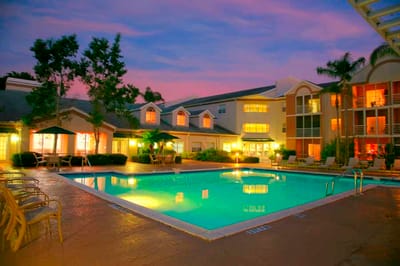 Pool area of a senior living facility at sunset
