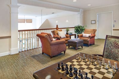 Common area with comfortable seating and a chess board
