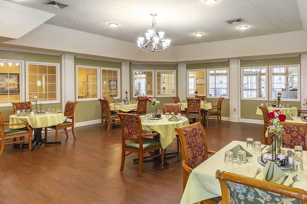 Dining area set for a meal with floral decor