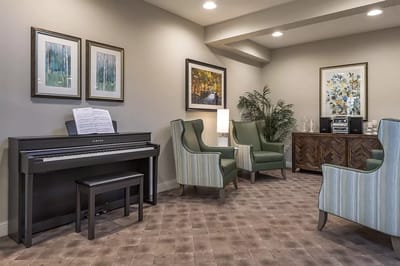 Interior lounge area with piano and seating