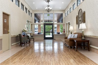 Well-lit interior common area with seating and decor
