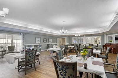 Dining room with tables set for residents