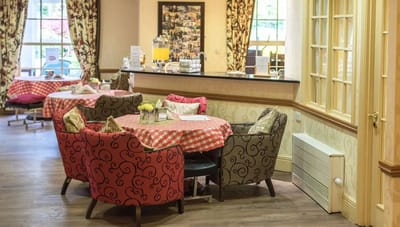 Cozy dining area with patterned chairs and tables