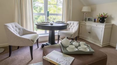 A cozy interior sitting area with a table